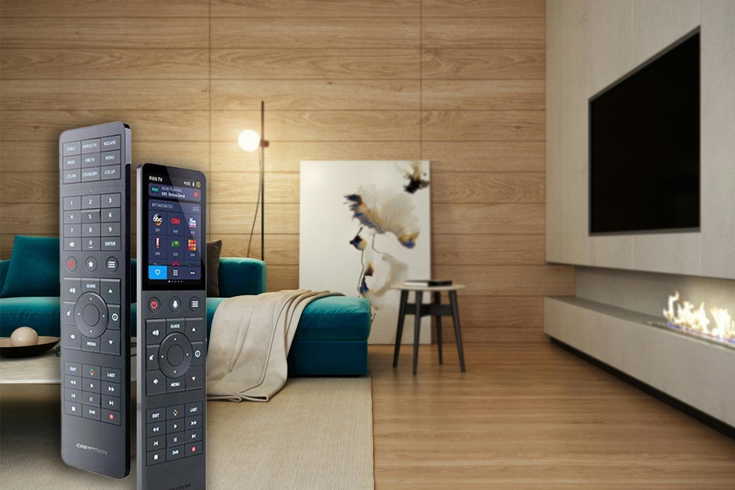 Living room with wood panel walls, a modern teal sofa, a remote control displayed prominently in the foreground, and a sleek wall-mounted TV above a fireplace.